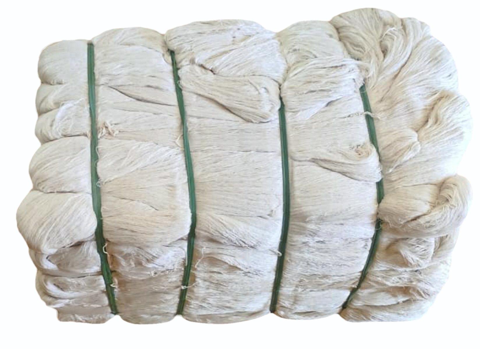 White hank yarn bundles arranged for measurement and yarn count preparation